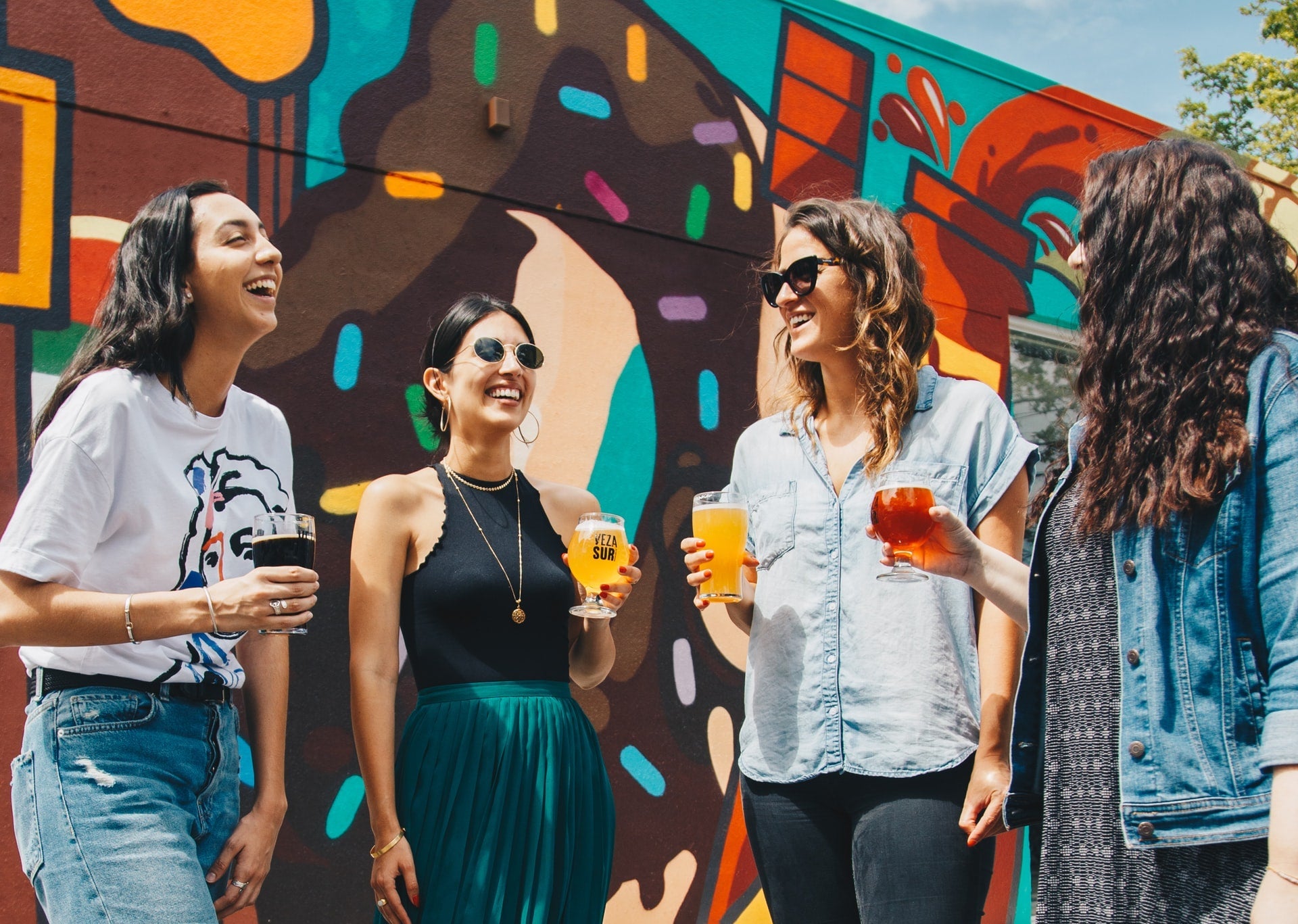 a group of women drinking different types of sour beers