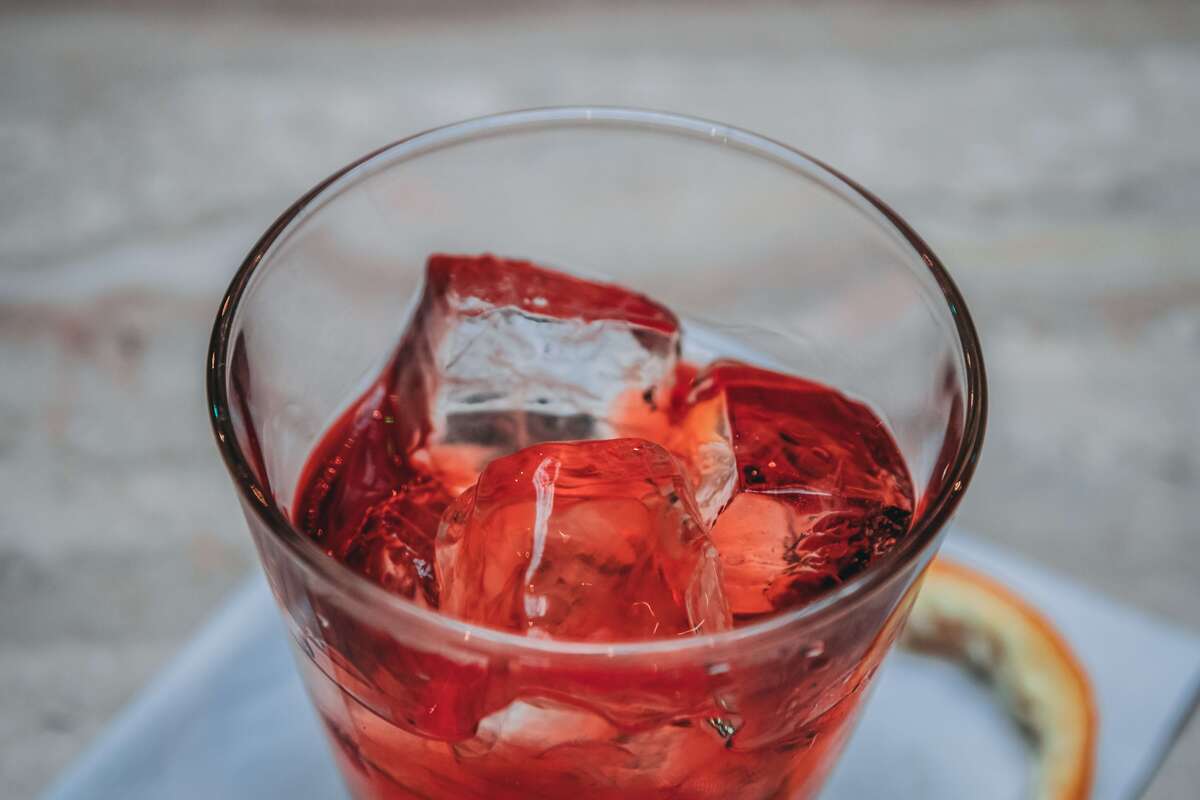Glass full of red fruit seltzer