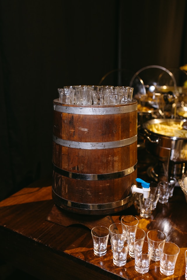 A barrel of fruit cider with glasses