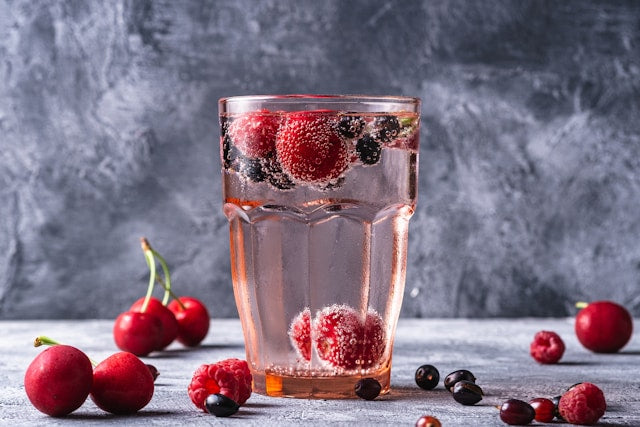 Glass of seltzer and berries